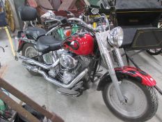 A 2004 red Harley Davidson V twin with security alarm, 1450cc, first registered May 2004.