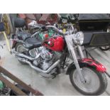 A 2004 red Harley Davidson V twin with security alarm, 1450cc, first registered May 2004.