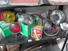 A large collection of new boxed and used headlamp, fog lamps,