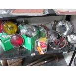 A large collection of new boxed and used headlamp, fog lamps,