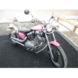 A Yamaha Virago V twin in metallic pink. First registered July 1988, currently on sorn.