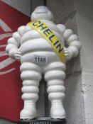 A standing cast iron figure of Bibendum Michelin Man
