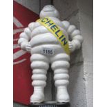 A standing cast iron figure of Bibendum Michelin Man