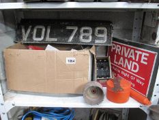 An ATIKA log press (new), 3 old vintage number plates,