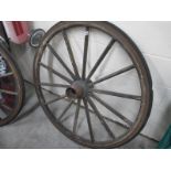 A large decorative wagon wheel, approximately 4ft diameter, with 11" hub..