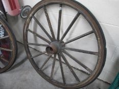 A large decorative wagon wheel, approximately 4ft diameter, with 11" hub..