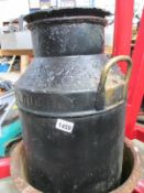 A fantastic weathered vintage milk churn marked with the name 'Willooughby'.