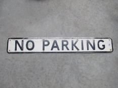 A vintage pressed aluminium No Parking road sign