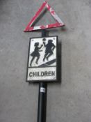 A cast iron Children playing street sign