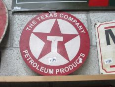 A round The Texas Company Petroleum Products painted metal sign