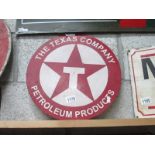 A round The Texas Company Petroleum Products painted metal sign