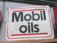 A painted metal Mobil Oils sign (approximately 40 x 30cm)