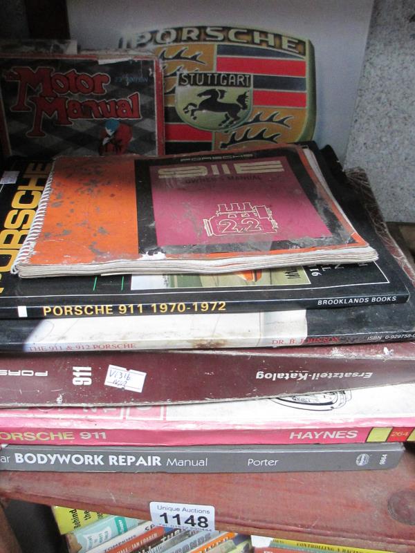 A quantity of books on Porsche including 911 spare parts catalogue and owners manual etc