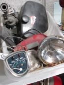 A box of Honda C50 miscellaneous parts including side covers and speedo