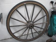 A large decorative wagon wheel, approximately 4ft diameter.