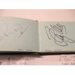 An autograph album containing an assortment of signatures principally from motorcycle racing