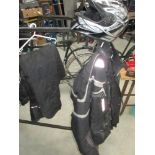 A large full face motorcycle helmet and a 2 piece crane Armour suit XL