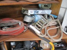 A large collection of ratchet straps, ties,