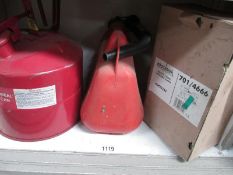 A metal fuel can and a plastic fuel container and a Micromark security alarm