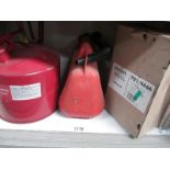 A metal fuel can and a plastic fuel container and a Micromark security alarm