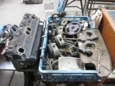 A Chevrolet 350 cylinder head, con rods, pistons,