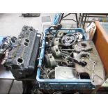 A Chevrolet 350 cylinder head, con rods, pistons,