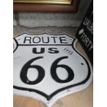 A cast iron Route 66 wall plaque