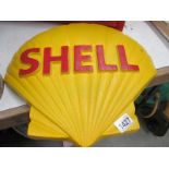 A large cast iron shell emblem wall plaque.