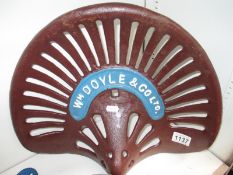 A cast iron Doyle & Co tracker seat