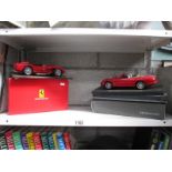 A boxed Burago Ferrari 250 Testarossa (1957) and a Maisto Jaguar XKR (1998(