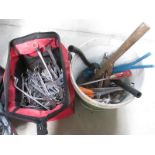 A bucket of tools and a bag of spanners