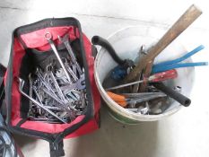 A bucket of tools and a bag of spanners