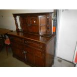 An oak Ercol style sideboard.