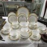 Approximately 22 pieces of Royal Crown Derby Heraldic pattern tea ware.