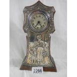 A silver framed mantel clock in good condition,