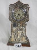 A silver framed mantel clock in good condition,