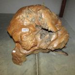 A swamp wood carving of a dog.