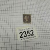 A folder of UK stamps including a penny black, 21 penny reds,