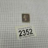 A folder of UK stamps including a penny black, 21 penny reds,