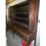 A Georgian oak dresser, approximately 96.75'' wide x 80'' high x 22.75'' deep.