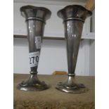 A pair of hall marked silver spill vases,