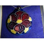 An original Moorcroft pendant attached silver chain, in box.