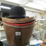 A leather cased bowler hat marked Christy's London.