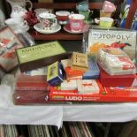 A mixed lot of vintage games and playing cards including Monopoly, Totopoly etc.