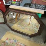 An oak framed bevel edged mirror.