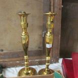 A pair of tall brass lamp bases.