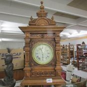 A late Victorian tall oak mantel/bracket clock with silvered dial, in very good condition. 28" tall.