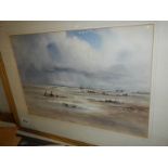 A framed and glazed water colour beach scene signed Stuart Gray.