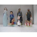 A collection of figurines including Lladro, Bunnykins,