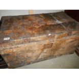 An old hide covered cabin trunk.